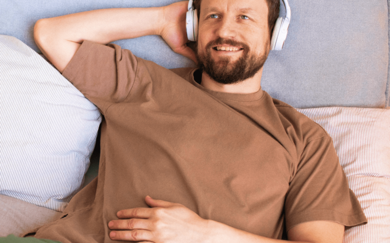 Man relaxing while wearing a Klova Micronutrient Patch on his arm